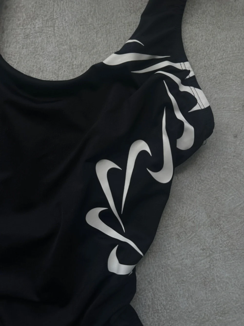 Nike Black One-Piece Swimsuit with White Swoosh Wave Accents - Picture 2 of 3